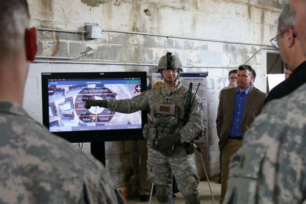 1st Lt. Cole W. Holland demonstrates the Maneuver Aviation Fires Integrated Application at the Army Expeditionary Warfighter Experiments on Fort Benning, Ga., March 3, 2015. (U.S. Army photo: Kelly Ann DeWitt)