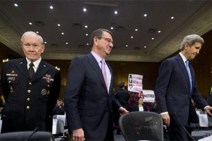 Gen. Martin Dempsey, Defense Secretary Ash Carter, and Secretary of State John Kerry, arrive on Capitol Hill, Wednesday, March 11, 2015, to testify before the Senate Foreign Relation Committee. (AP Photo/Pablo Martinez Monsivais)