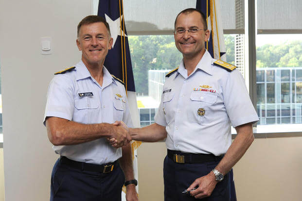 Adm. Paul F. Zukunft, commandant of the Coast Guard, shakes hands with Vice Adm. Charles D. Michel at Coast Guard Headquarters in Washington, Aug. 17, 2015. (U.S. Coast Guard photo by Chief Petty Officer Kyle Niemi)