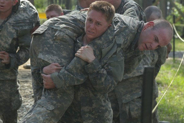 Maj. Lisa A. Jaster, 37, carries a fellow soldier during the Darby Queen obstacle course at Ranger School at Fort Benning, Ga., April 26, 2015. (U.S. Army)