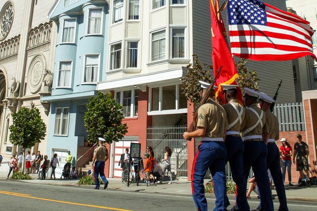 A Marine Corps color guard marches during the Italian heritage parade on Oct. 11, as part of San Francisco Fleet Week 2015. Photo By: Cpl. Joshua Murray