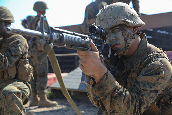 Marine Corps Pfc. Mason A. Davis provides security while his fire team works its way through one of the 12 obstacles at Edson Range, Marine Corps Base Camp Pendleton, Sept. 23, 2015. (U.S. Marine Corps/Cpl. Jericho Crutcher)