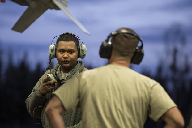 Senior Airman Terrence Lawrence, a 354th Aircraft Maintenance Squadron aircraft electrical and environmental systems journeyman, receives advice from Tech. Sgt. Glen Rathburn, a 354th AMXS maintainer. (Photo: Staff Sgt. Joshua Turner)