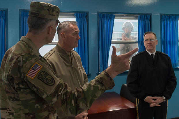 Marine Corps Gen. Joseph F. Dunford Jr. is briefed by U.S. Army Col. James Minnich during his visit to the Demilitarized Zone in the Republic of Korea, Nov. 2, 2015. (Photo by: Navy Petty Officer 2nd Class Dominique A. Pineiro)