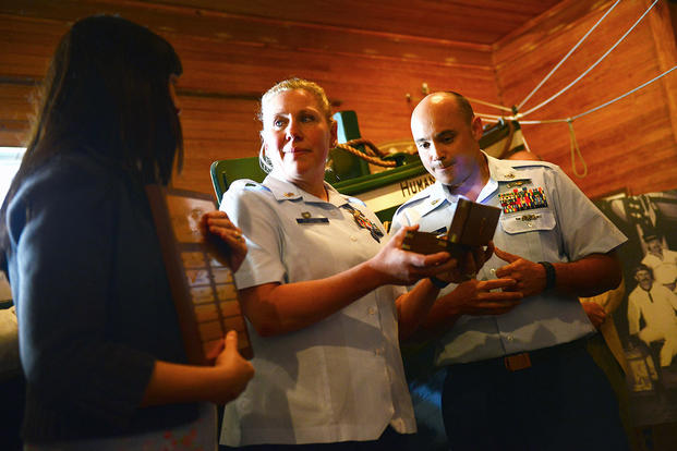 Senior Chief Petty Officer Eric Brown and Chief Petty Officer Amy Petersen Brown are presented the Newmyer Maritime Heritage Award Wednesday, April 13, 2016 at the Hull Lifesaving Museum in Hull, Massachusetts. (U.S. Coast Guard/PO2 Cynthia Oldham)