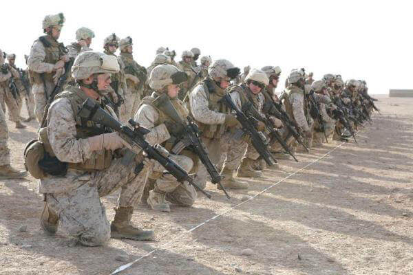 Marines kneeling.
