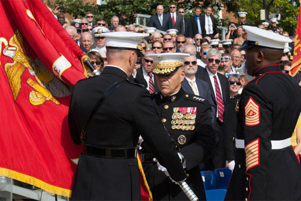 Commandant of the Marine Corps, Gen. Robert B. Neller, center, accepts the Marine Corps colors from Gen. Joseph F. Dunford, Jr. at Marine Barracks Washington, D.C., Sept. 24, 2015. (Photo By: Sgt. Melissa Marnell)