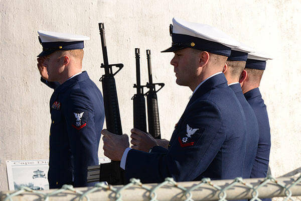 Members of Coast Guard Station Cape Disappointment prepare for the 21-gun salute during a memorial ceremony that honored Coast Guardsmen and fishermen who have perished along the Columbia and Quillayute Rivers. (U.S. Coast Guard/PO3 Jonathan Klingenberg)
