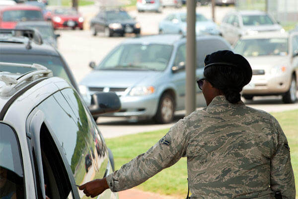 U.S. Air Force Airman 1st Class Candace Lowe, 633rd Security Forces Squadron installation entry controller, provides security at Langley Air Force Base, Va., Aug. 1, 2012 (U.S. Air Force photo by Tech. Sgt. Barry Loo/Released)