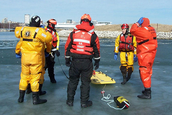 Members from Coast Guard Station Milwaukee and local first responders prepare for a rescue drill during ice rescue training in Milwaukee, Feb. 28, 2016. (Coast Guard photo by Lt. j.g. Tom Morrell)