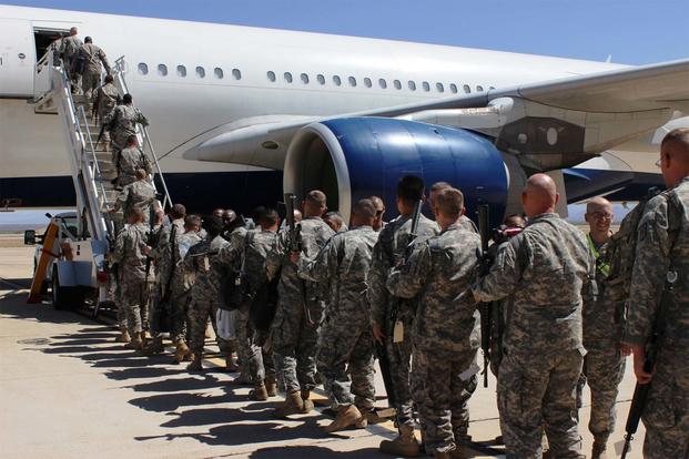 FILE -- Soldiers board their plane for deployment at Libby Army Airfield. (Photo Credit: Gabrielle Kuholski)