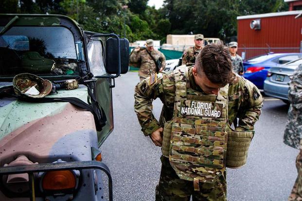 FILE -- Soldiers from 2nd Battalion, 124th Infantry Regiment, prepare to head out to assist with Hurricane Matthew relief efforts in Fern Creek, FL, October 8, 2016 (U.S. Army/Spec. James M. Lanza, 107th MPAD)