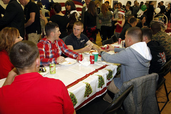 15th Marine Expeditionary Unit Command Element Marines enjoy a meal at the holiday party in 2011. Cpl. John Robbart III/Marine Corps