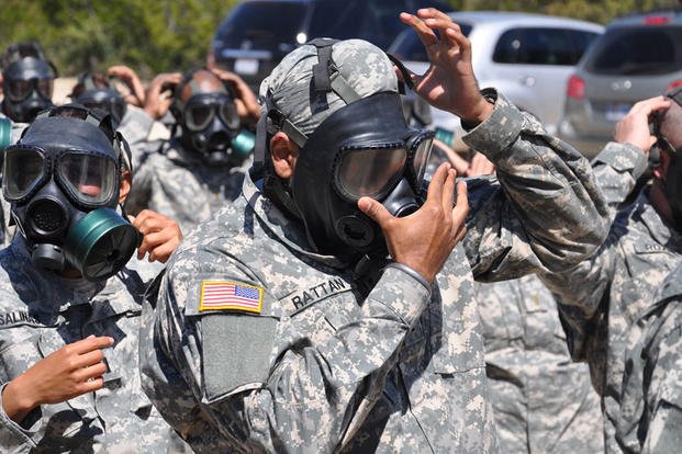 Army Capt. (Dr.) Tejdeep Singh Rattan checks the seal on his gas mask before entering the gas chamber during nuclear, biological and chemical training at Camp Bullis, Texas, in 2010, when he attended the Basic Officer Leadership Course. Steve Elliott/Army