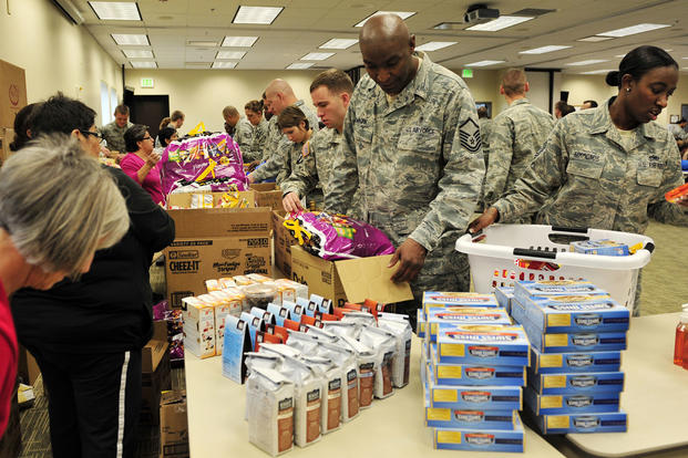 Members from Buckley Air Force Base, Colorado, and the Smokey Hill Vineyard Food Bank joined together to bring food to military families Nov. 19, 2012, at the base chapel. Airman 1st Class Darryl Bolden Jr./Air Force