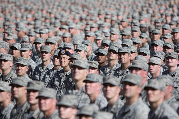 Soldiers and airmen from the Arizona National Guard assemble in a mass formation during the Arizona National Guard Muster in 2014. U.S. Army National Guard Photo by Staff Sgt. Brian A. Barbour