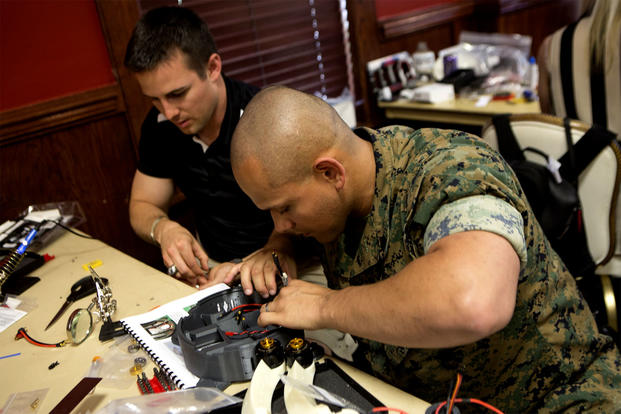 Marine and Contractor Assemble Nibbler Drone
