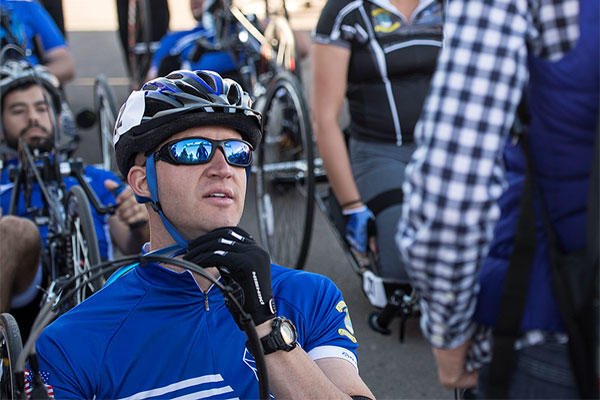 Former Senior Airman Jeremiah Means speaks to his wife Ashley before his race begins at the Warrior Games cycling event Sept. 29, 2014, at Fort Carson, Colo. Senior Airman Jette Carr/Air Force