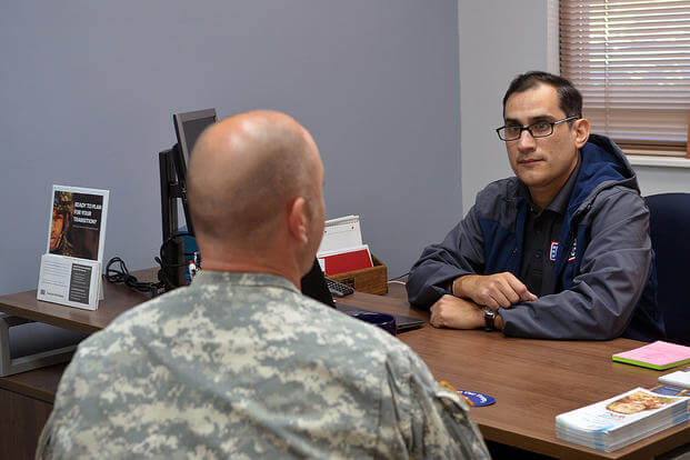 A counselor speaks to a soldier at the USO's RP/6 center near Fort Campbell, Kentucky. Photo: Courtesy of the USO