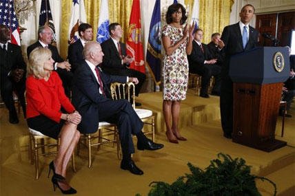 President Barack Obama speaks in the East Room of the White House in Washington, Tuesday, April 30, 2013, about jobs for veterans. From left are, Jill Biden, wife of Vice President Joe Biden, the vice president and first lady Michelle Obama.