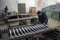 A worker assembles mortar shells at a factory in Ukraine