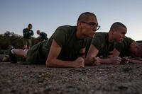 U.S. Marine Corps recruits conduct the plank portion of their initial strength test at Marine Corps Recruit Depot San Diego.