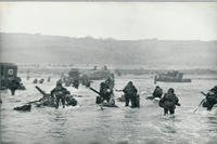 One of war photographer Robert Capa’s images shows a wave of troops arriving on the Normandy beaches on D-Day.