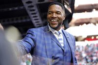 Fox Sports announcer Michael Strahan looks on before Super Bowl LVII on Feb. 12, 2023, in Glendale, Arizona.