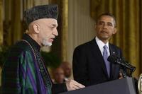 President Barack Obama listens as Afghan President Hamid Karzai speaks during a news conference in the East Room at the White House in Washington, Friday, Jan. 11, 2013. (AP Photo/Charles Dharapak)
