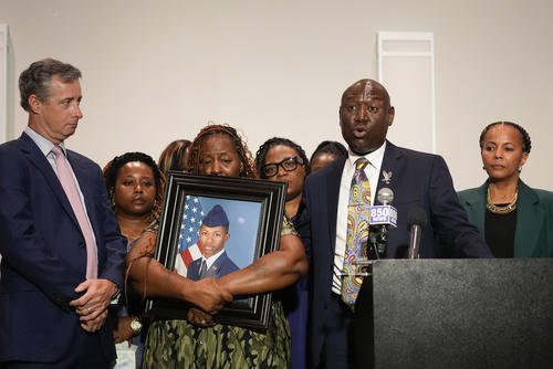 Chantemekki Fortson, mother of Roger Fortson, Air Force senior airman, holds a photo of her son.