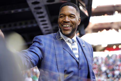 Fox Sports announcer Michael Strahan looks on before Super Bowl LVII on Feb. 12, 2023, in Glendale, Arizona.