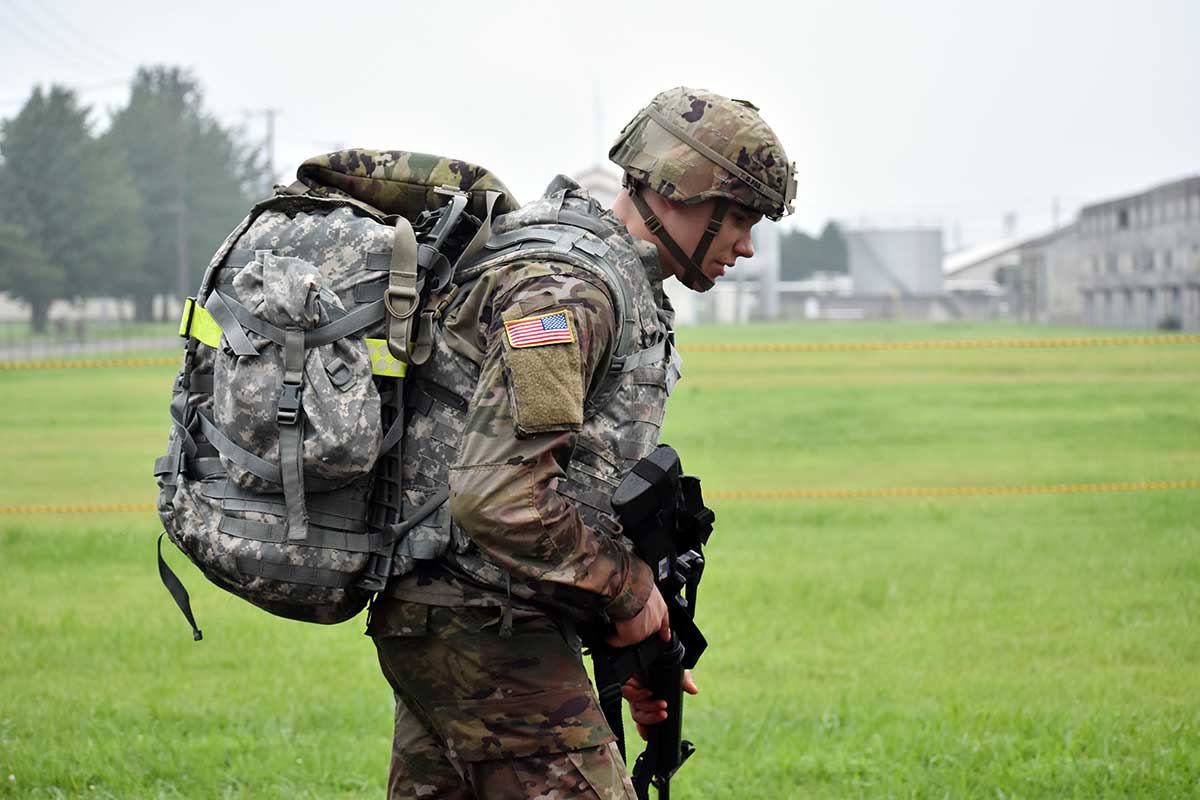 A soldier conducts a ruck march.