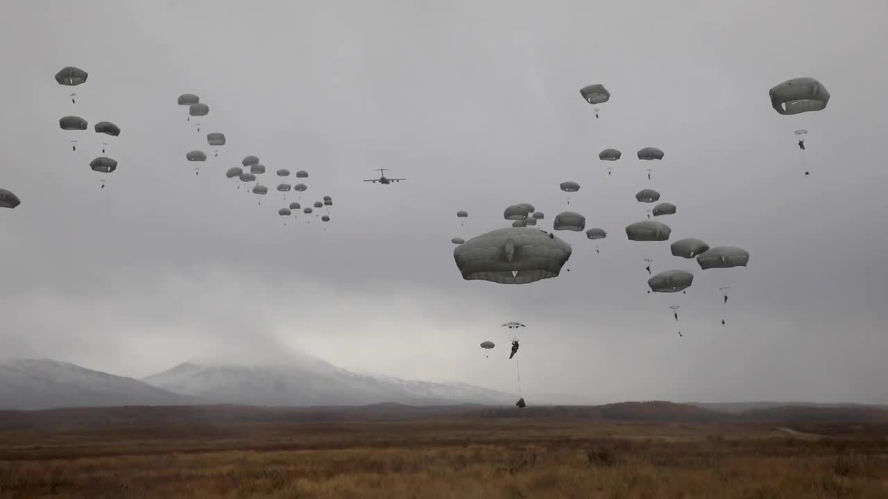 Airmen jumping from a plane