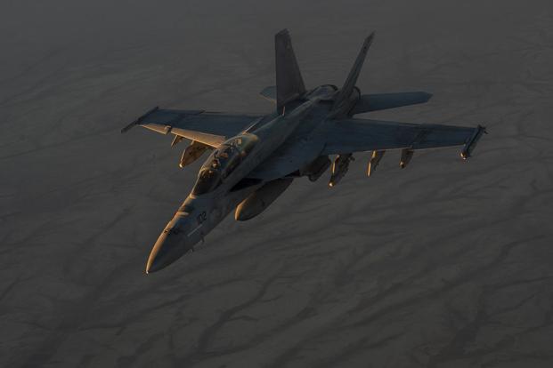 A U.S. Navy F/A-18 flies in formation after conducting aerial refueling operations with a KC-135 Stratotanker over Syria on Oct. 18, 2017. Sen. Joni Ernst has introduced a bill calling for the Navy to report on its efforts to solve pilot hypoxia incidents. Tech. Sgt. Gregory Brook/Air Force