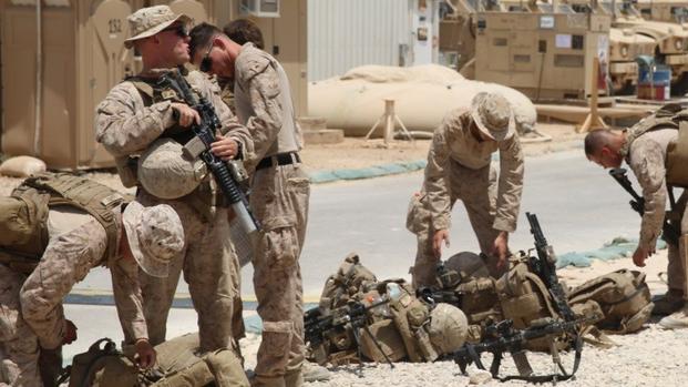 U.S. Marines attached to Task Force Al Asad with 1st Battalion, 7th Marine Regiment, Special Purpose Marine Air-Ground Task Force-Crisis Response-Central Command, prepare to assume their security positions while at Al Asad Air Base, Iraq, July 5, 2017. (U.S. Marine Corps photo/Dave Williams) 