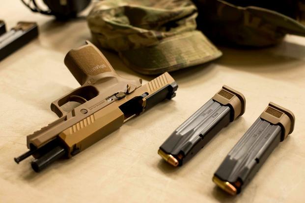 The U.S. Army has finalized a plan to dual arm combat leaders down to the team-leader level with the new XM17 Modular Handgun System. (U.S. Army photo)