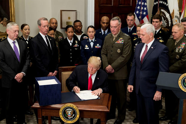 President Trump signs the National Defense Authorization Act for fiscal year 2018, in the Roosevelt Room at the White House on Dec. 12. (White House photo/Stephanie Chasez)