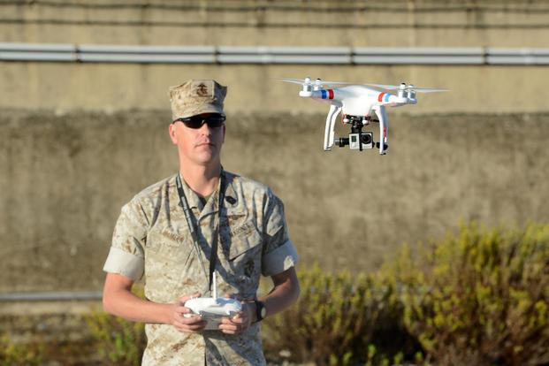 Master Sgt. Chad E. McMeen uses a commercial-grade Quadcopter to capture aerial video footage of the USNS William R. Button on the pier in Rota, Spain, in 2015. (U.S. Army photo by Visual Information Specialist Jason Johnston)