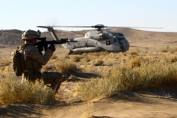 U.S. Marine Lance Cpl. John Lynch, a 22-year-old Brookfield, Conn., native and motor transport operator with 1st Battalion, 25th Marine Regiment, posts security during an air interdiction force mission.