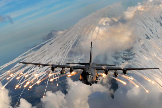 An AC-130 gunship jettisons flares over an area near Hurlburt Field, Fla. (U.S. Air Force photo/Senior Airman Julianne Showalter)