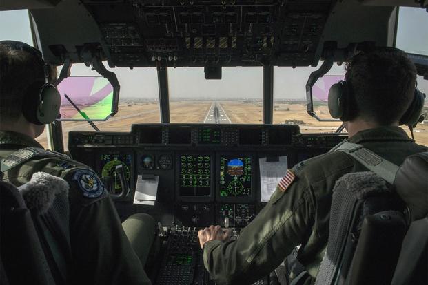 Two U.S. Air Force pilots prepare to land a C-130J Super Hercules Sept. 9, 2015, at Diyarbakir Air Base, Turkey. (U.S. Air Force/Airman 1st Class Cory W. Bush)