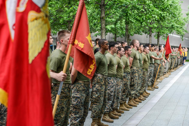 Marines, Sailors, and Coast Guardsmen stand in formation following the 2017 Freedom Run at the 9/11 Memorial Plaza in New York, May 28, 2017. Service members participated in the run to honor the lives lost in the 9/11 terrorist attacks. (U.S. Marine Corps photo/Troy Saunders)