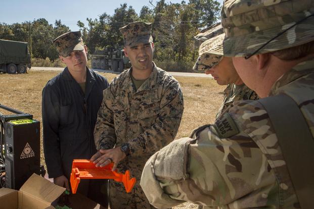 Marines with 2nd Maintenance Battalion, 2nd Marine Logistics Group demonstrate their 3-D printing capabilities during Exercise Bold Alligator 17 at Camp Lejeune, N.C., Oct. 26, 2017 (U.S. Marine Corps/Lance Cpl. Abrey D. Liggins)