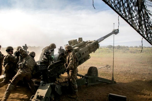 Army soldiers assigned to 25th Division Artillery prepare to fire a 155mm artillery round from an M777 howitzer, in support of Operation Lightning Strike on Pohakuloa Training Area, Hawaii, May 16, 2018. (US Army photo/Ian Morales)
