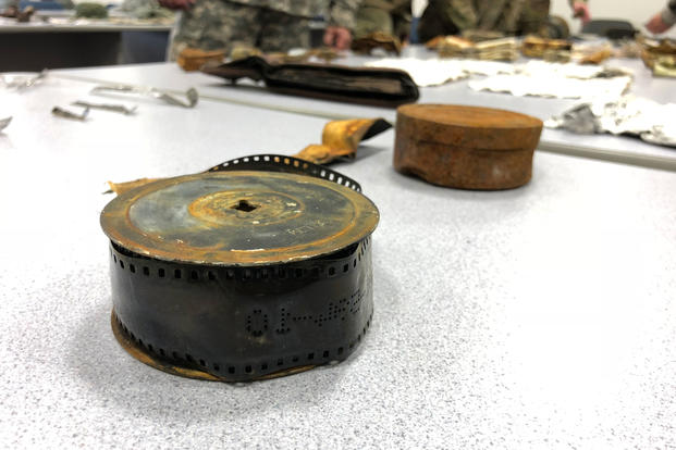 Artifacts recovered from the 2018 Colony glacier recovery mission are displayed on Joint Base Elmendorf-Richardson, Alaska. The mission recovers both human remains and personal items from a 1952 Air Force crash in which 52 U.S. troops perished. (Military.com/Amy Bushatz)