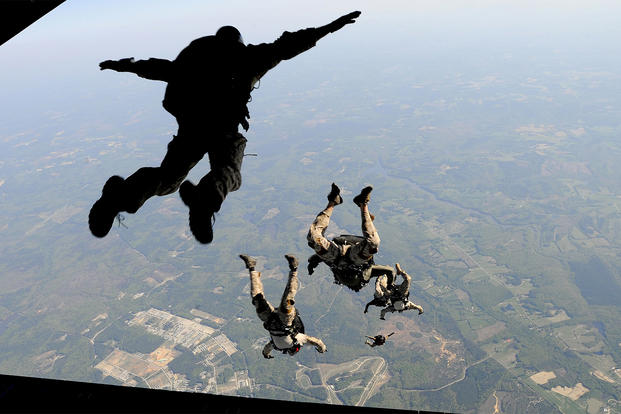 Navy SEALs jump from the ramp of a C-17 Globemaster (U. S. Air Force/Brian Ferguson)