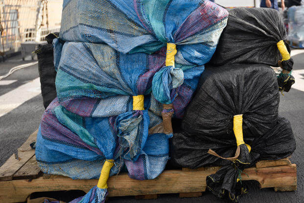 Bales of cocaine lie on a pallet onboard the Coast Guard Cutter Hamilton in Port Everglades, Aug. 1, 2018. The drugs were seized during the interdiction of five suspected smuggling vessels and the recovery of two floating bale fields found off the coasts of Mexico, Central and South America by Coast Guard Cutters Hamilton (WMSL-753), Alert (WMEC-630), and Venturous (WMEC-625). (Coast Guard photo/Brandon Murray)