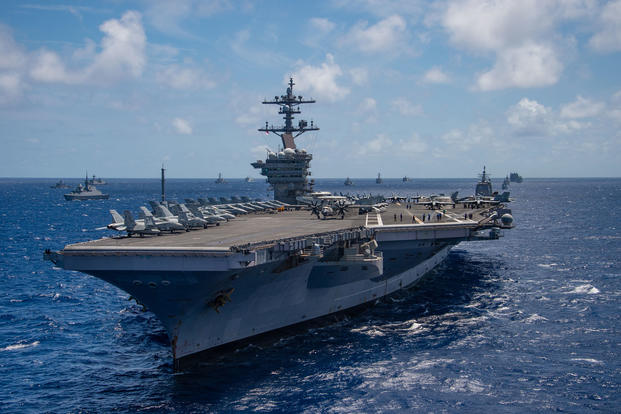 The aircraft carrier USS Carl Vinson (CVN 70) participates in a group sail during the Rim of the Pacific (RIMPAC) exercise off the coast of Hawaii, July 26, 2018. (U.S. Navy photo/Arthurgwain L. Marquez)