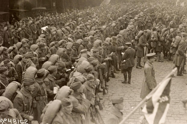 Soldiers from the 308th Infantry Regiment of the 77th Division, a unit made up of New York City draftees, who had been part of the "Lost Battalion" in October 1918 in Hoboken, New Jersey on April 29, 1919 after returning from France. 540 members of the unit were trapped behind German lines from October 2 to October 8. 1918 and 170 died. (U.S. Army Signal Corps)
