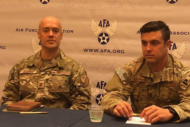 Air Force Maj. Charles Hodges, left, and Master Sgt. Derek Anderson, both of the 320th Special Tactics Squadron, out of the 353rd Special Operations Group, based in Kadena, Japan, discuss their contributions to the rescue of a Thai soccer team from a cave system during the Air Force Association conference in September 2018. Hope Hodge Seck/Military.com 